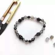 Perle tête de mort 8x6 mm imitation Howlite teintée - Noir x1