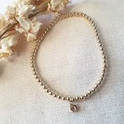 Bracelet élastique avec perles rondes 3 mm -  Gold filled (or laminé)  x1