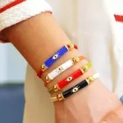 Perle tube incurvé en résine époxy & oxydes de Zirconium 33x8 mm motif oeil - Doré - Noir x1