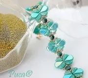 Perles en verre Amos® par Puca® 5x8 mm - Jet Iris Luster x10g