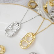 Pendentif double trous languette de capsule 20x12 mm avec oxydes de Zirconium - Doré x1