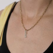 Pendentif Love avec oxydes zirconium 26x7 mm - Acier inoxydable 316L Doré x1