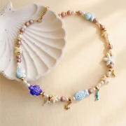 Perles coquillage 15x12 mm en céramique - Bleu clair x5