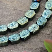 Perle imitation Hematite Tête de Bouddha 8.5x7x4 mm Light Green Metallic x1