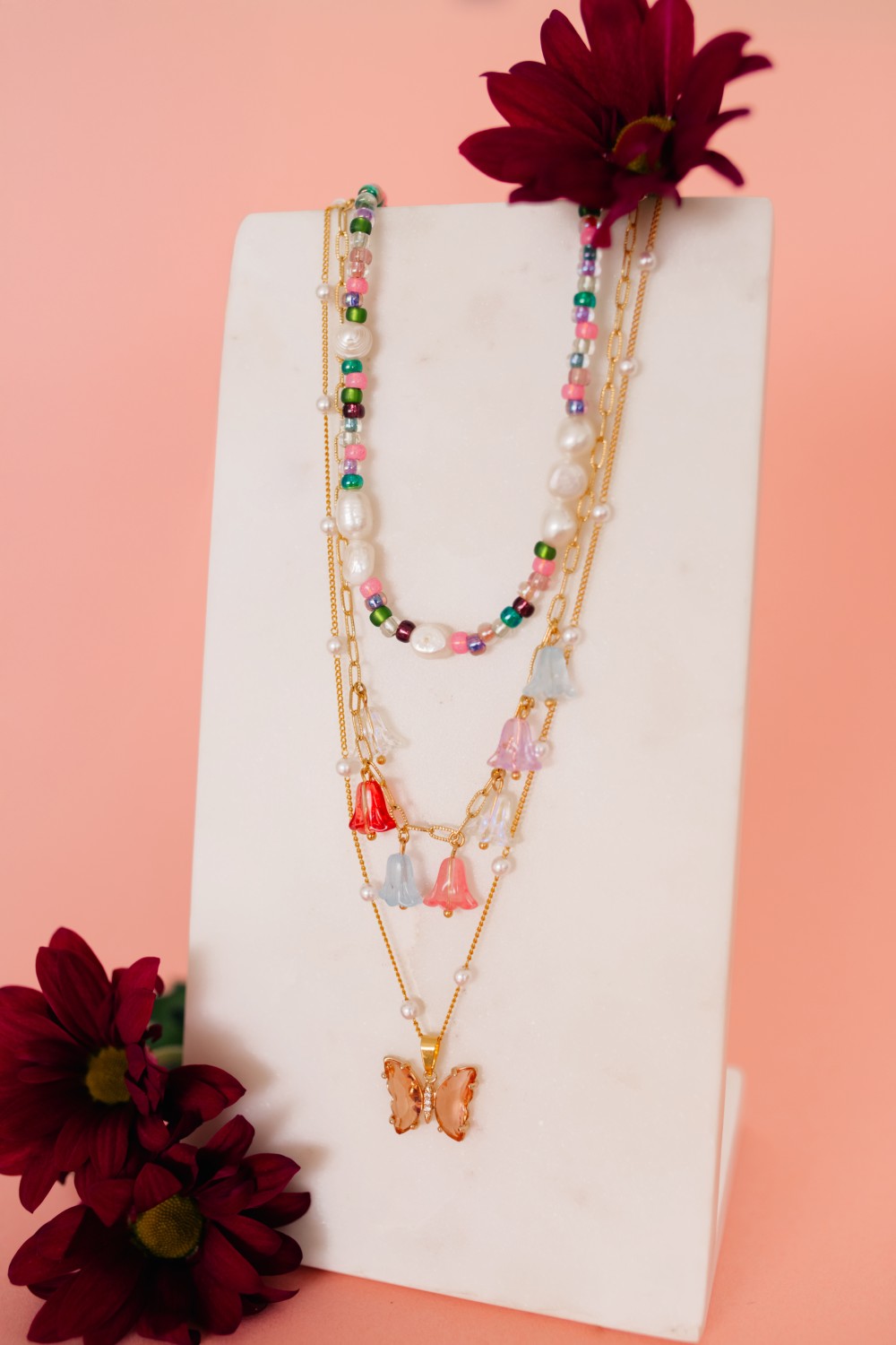 Colliers roses et verts avec pendentif papillon et perles fleurs
